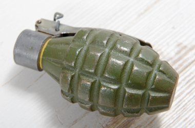 Hand grenade in green color clipart
