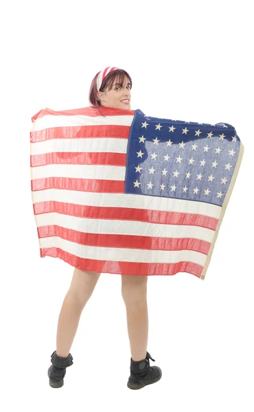 Pretty young woman isolated holding an American Flag — Stock Photo, Image