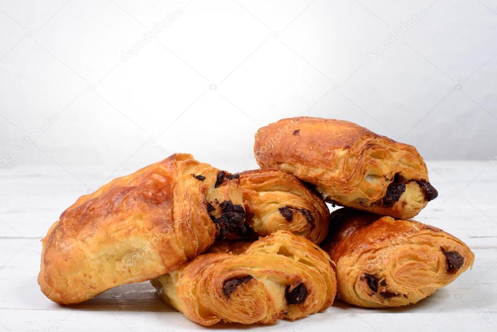 chocolate croissant on a white table