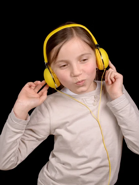 Una joven con auriculares —  Fotos de Stock