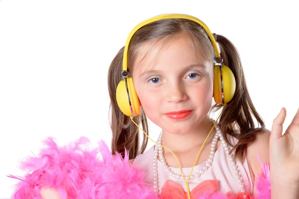 Portrait of a little girl with a yellow headphones — Stock Photo, Image