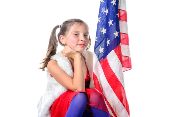 A pretty little girl with a american flag — Stock Photo, Image