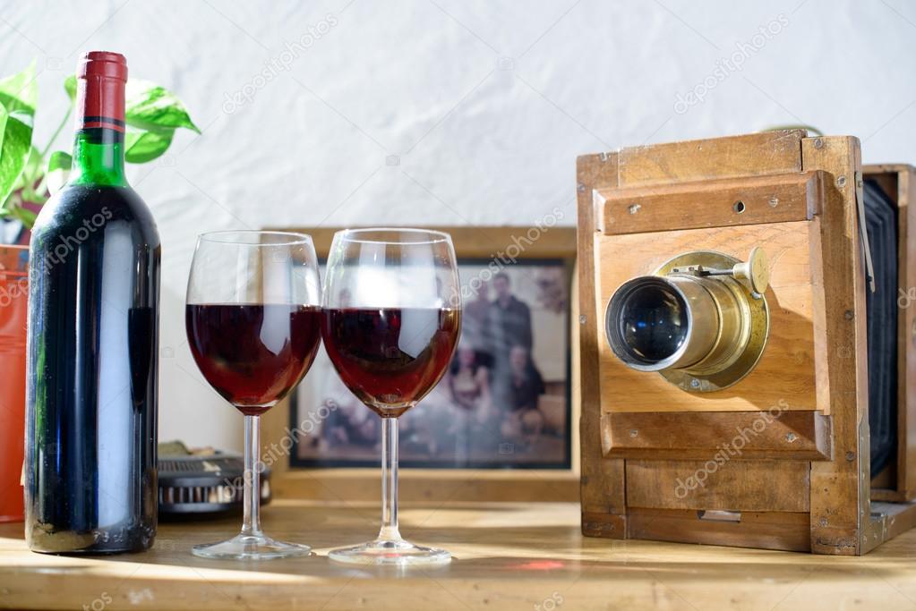 glasses of wine with an old camera