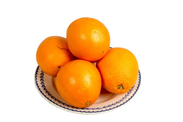 Several oranges in an old dish — Stock Photo, Image