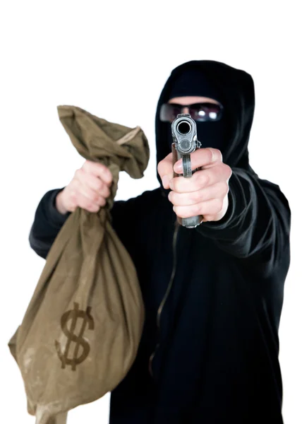 Hooded robber with a gun and a bag of money — Stock Photo, Image