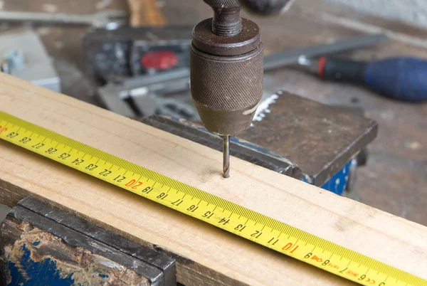 Drilling of wood with an old hand drill — Stock Photo, Image