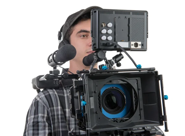 Молодой оператор и профессиональная камера — стоковое фото