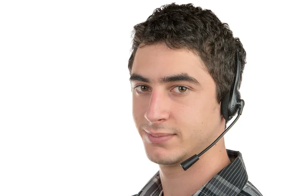 Un jeune homme travaillant sur la hotline — Photo