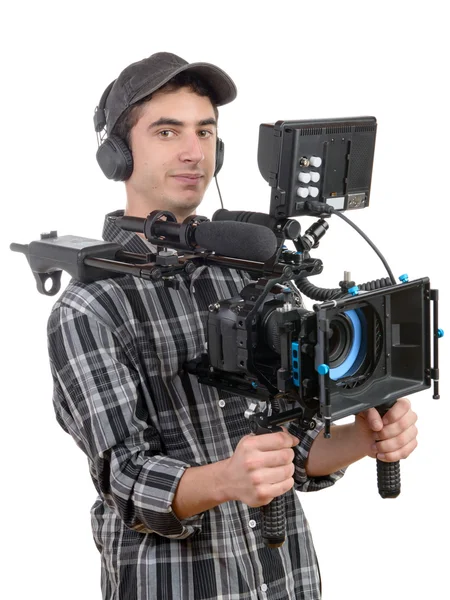 Joven camarógrafo con cámara profesional — Foto de Stock