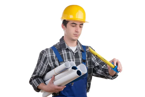 A worker measuring with a tape measure — Stock Photo, Image