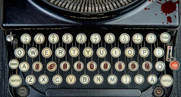 Old typewriter with terrorism — Stock Photo, Image