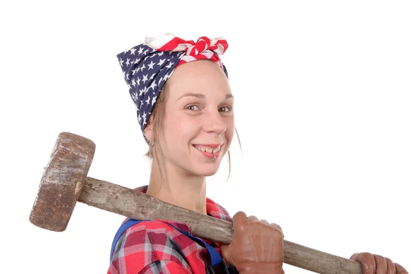 A pretty young working woman with a sledgehammer — Stock Photo, Image