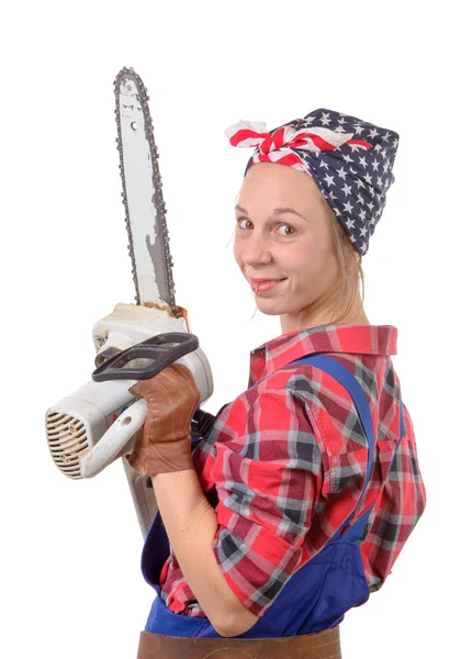 Vintage pretty young woman with a chainsaw — Stock Photo, Image