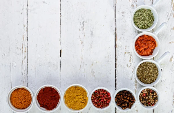 Indian spices on white wooden board — Stock Photo, Image