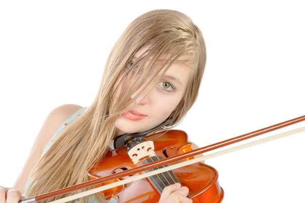 A teenage girl with long hair plays violin — Stock Photo, Image