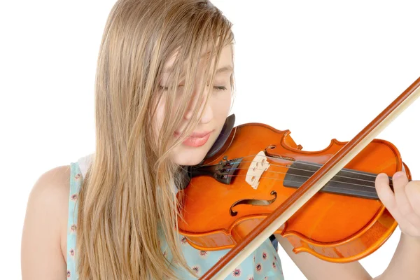 A teenage girl with long hair plays violin — Stock Photo, Image