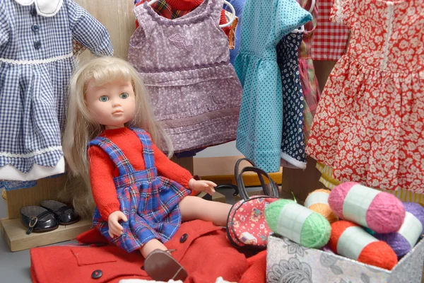 Doll with several dresses — Stock Photo, Image