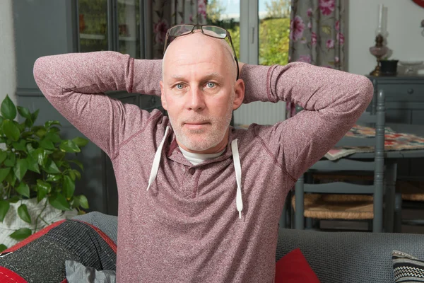 Man senior on a sofa — Stock Photo, Image