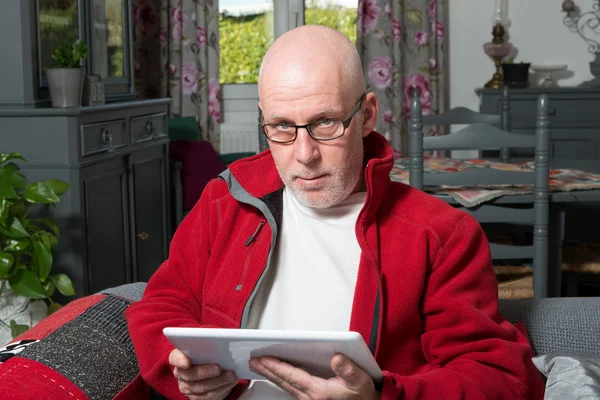 A senior man with a digital tablet — Stock Photo, Image