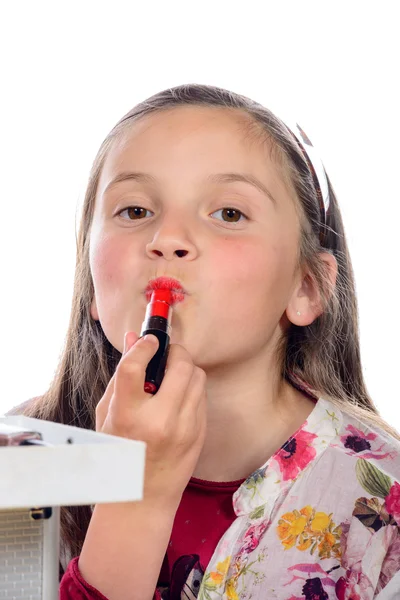 Ein kleines Mädchen schminkt seine Mutter — Stockfoto