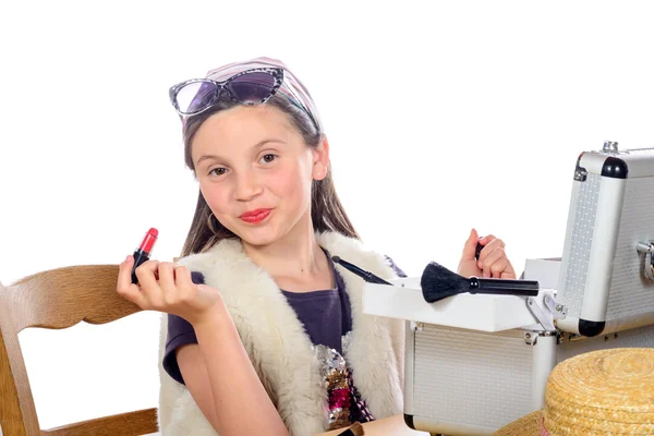 A little girl puts makeup of his mother — Stock Photo, Image