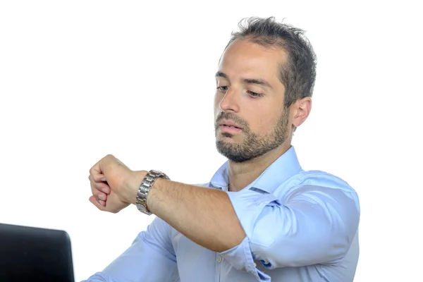 A young businessman looking at his watch — Stock Photo, Image