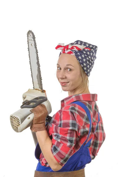Vintage pretty young woman with a chainsaw — Stock Photo, Image