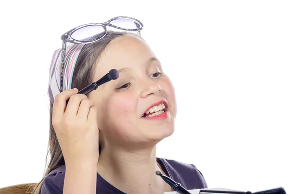 A little girl puts makeup of his mother — Stock Photo, Image