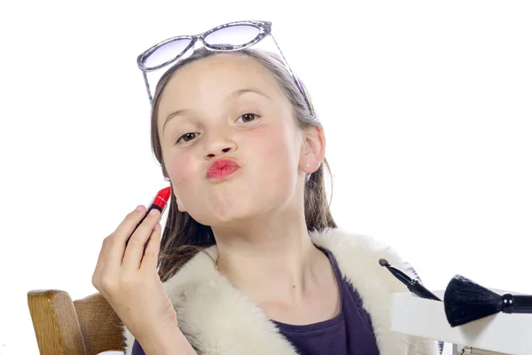 A pretty little girl with lipstick — Stock Photo, Image