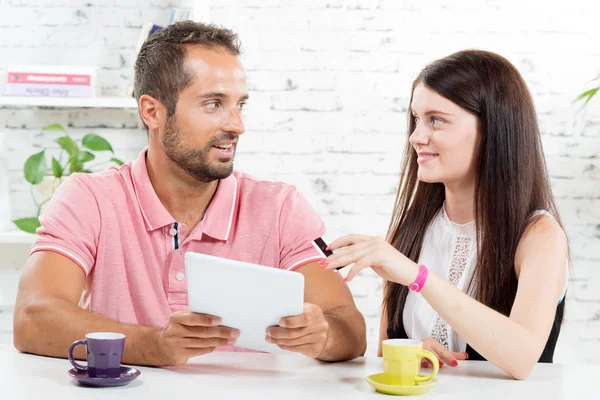 A young couple go shopping on internet — Stock Photo, Image