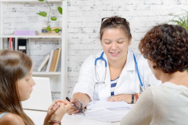 a little girl and her mother to the doctor