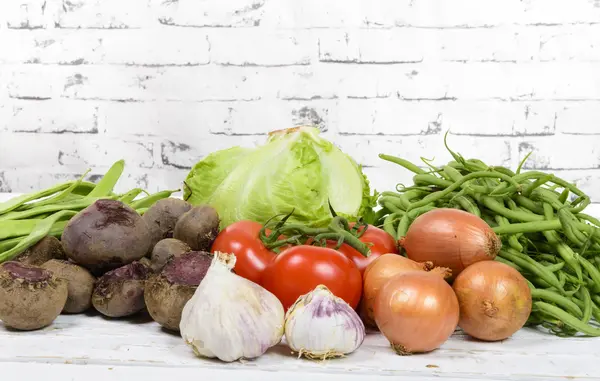 Different seasonal vegetables on a table — Stock Photo, Image