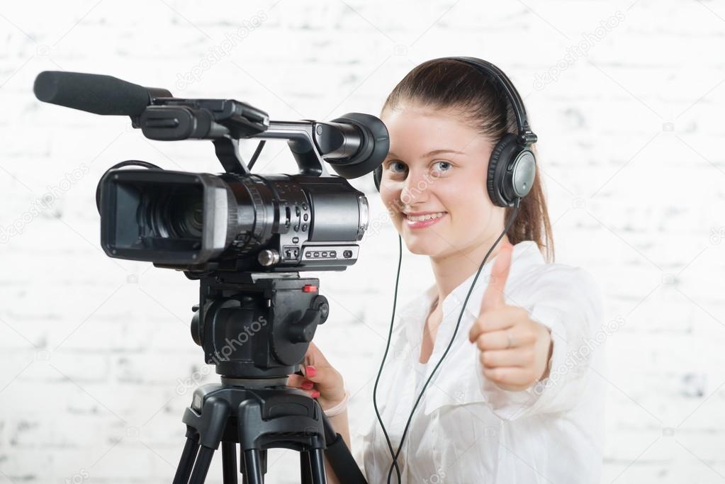 a pretty young woman with a professional camera