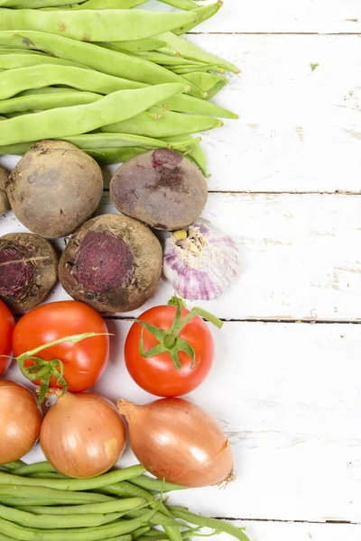 Various vegetables on a white wooden table — Stock Photo, Image