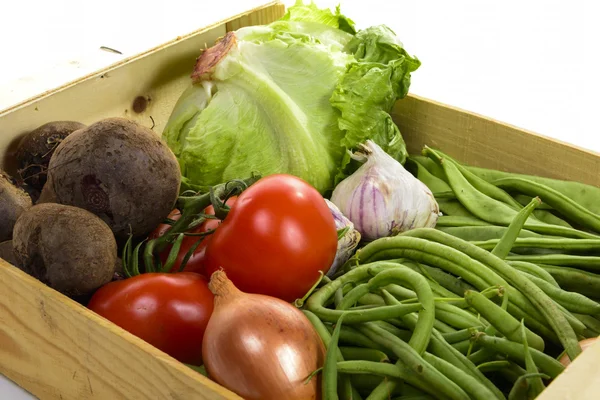 Seasonal vegetables in a crate isolated on a white background — Stock Photo, Image