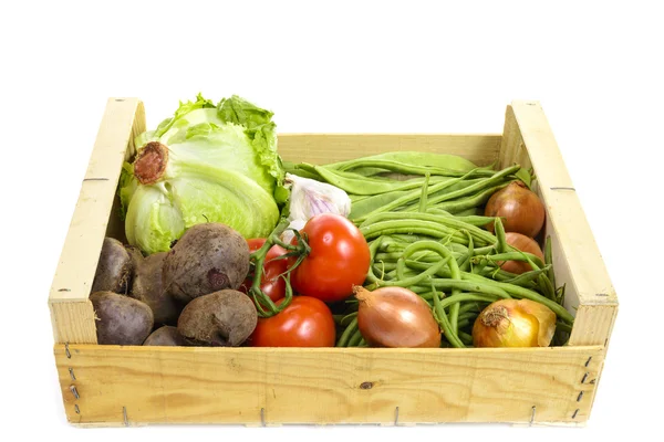 Seasonal vegetables in a crate isolated on a white background — Stock Photo, Image