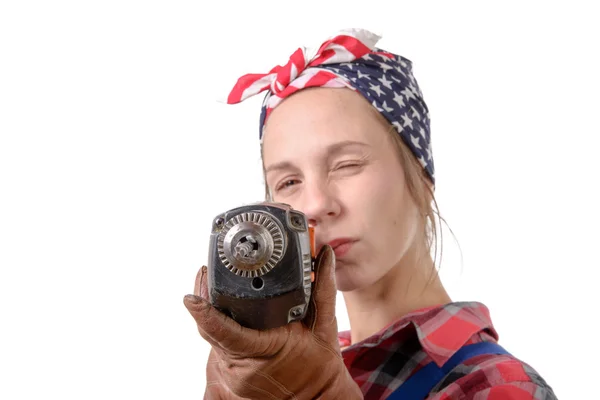 Vintage pretty young woman with a drill on the white background — Stock Photo, Image