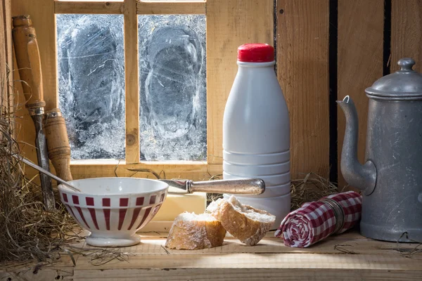 Sunny morning breakfast with milk near a window — Stock Photo, Image