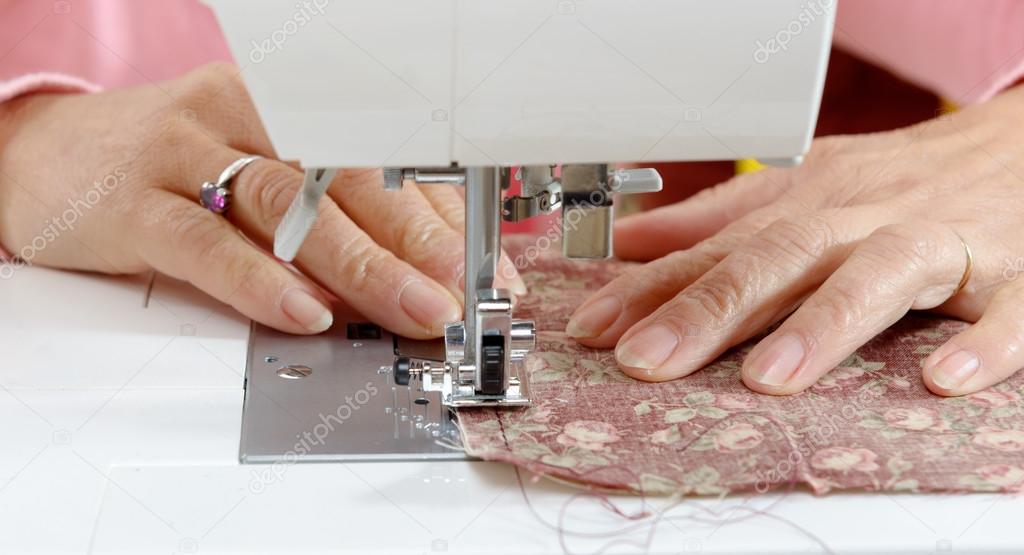 close-up of a seamstress working hands