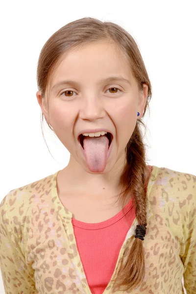 Niña saca su lengua —  Fotos de Stock