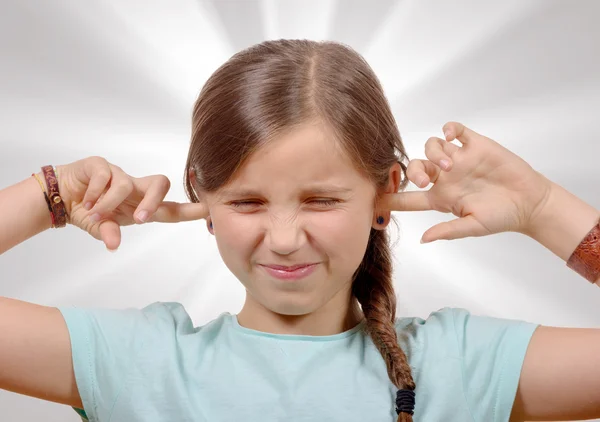 Girl covering her ears,to say stop making loud noise giving me — Stock Photo, Image