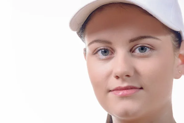 Close up of the face of a pretty young woman with a white cap — Stock Photo, Image