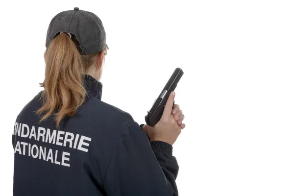 Gendarme femme vue de dos isolé sur un fond blanc — Photo