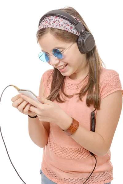 Happy school girl texting to someone. — Stock Photo, Image
