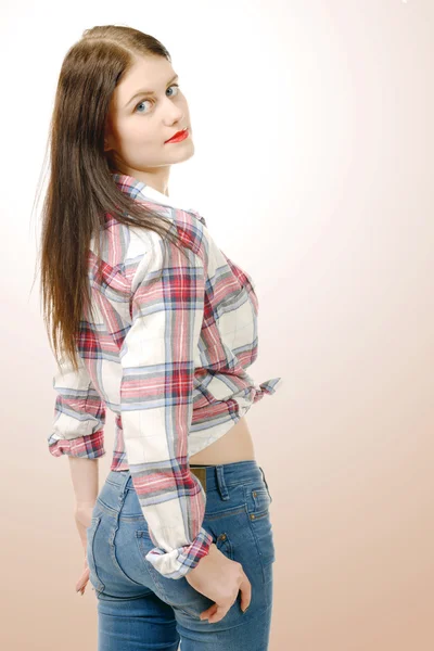 Pretty young woman standing, back view — Stock Photo, Image