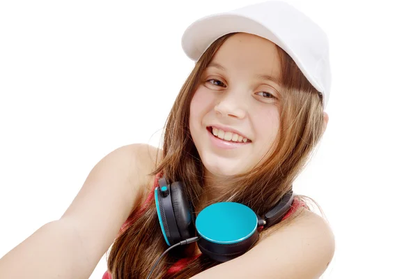 Portrét módy holčička s modrým sluchátka, na bílém — Stock fotografie