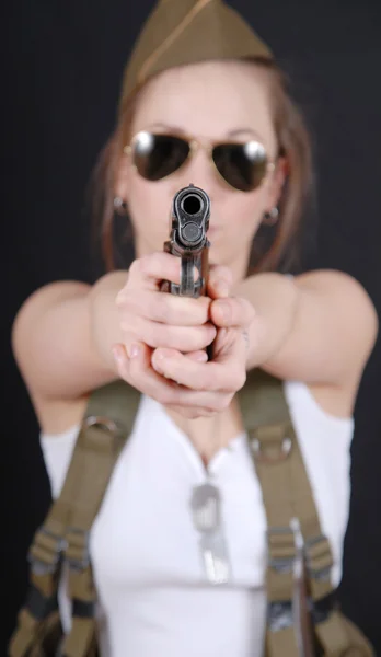 Sexy young woman posing in WW2 military uniform and a weapon — Stock Photo, Image