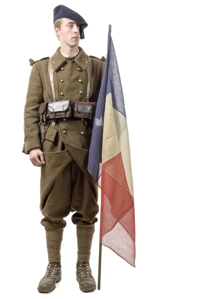 Soldado francés de 1940 con una bandera aislada sobre fondo blanco —  Fotos de Stock