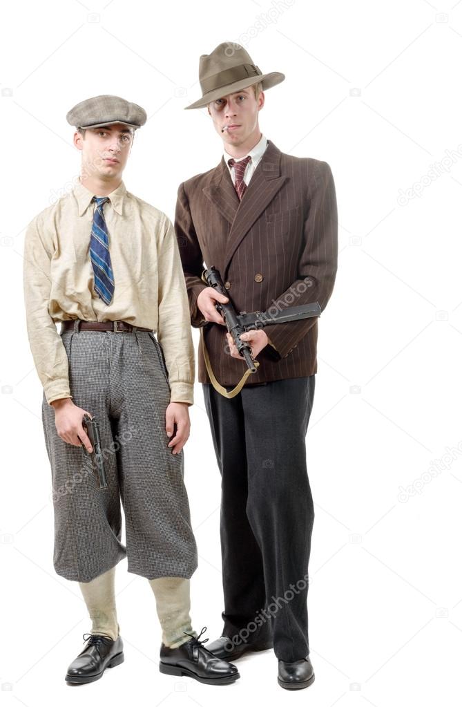 two gangster in vintage clothing, with guns, on white