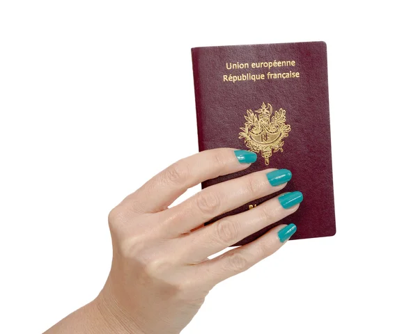 Fransız pasaportu, beyaz arka plan üzerinde izole kadın eliyle — Stok fotoğraf